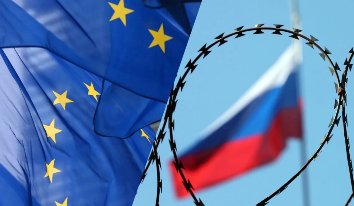 Прапори ЄС та Росії з колючим дротом як символ санкцій проти РФ